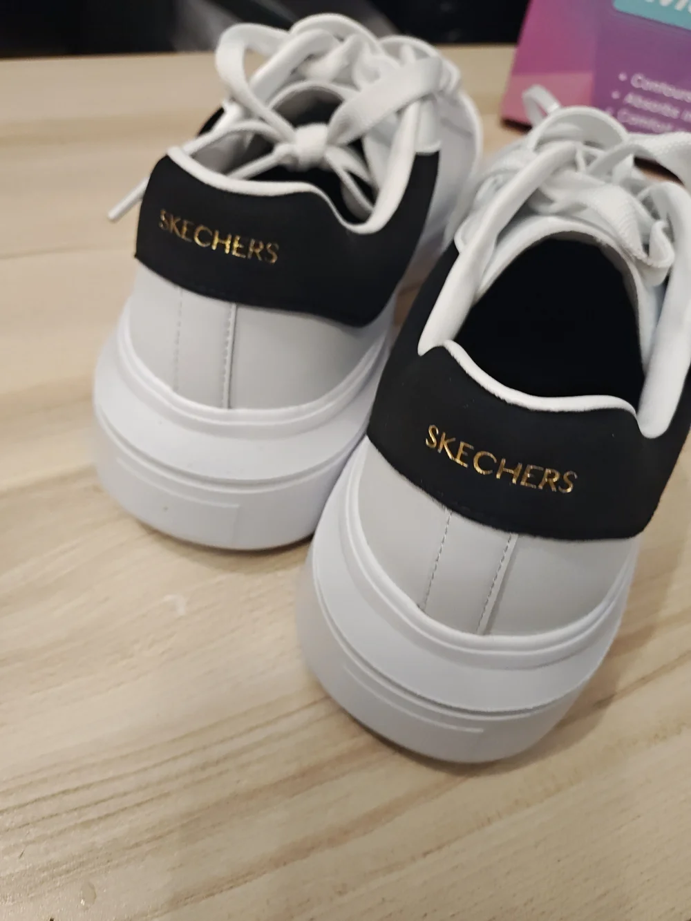 Skechers Men’s White Sneakers with Black Heel Accent 9